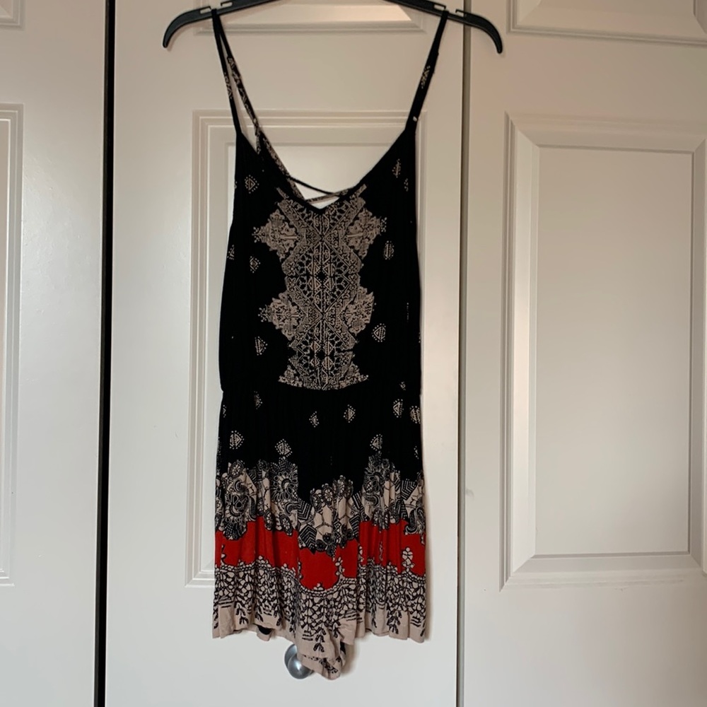 This is a cute spaghetti strap romper w/stretch around the waist and a bit sheer